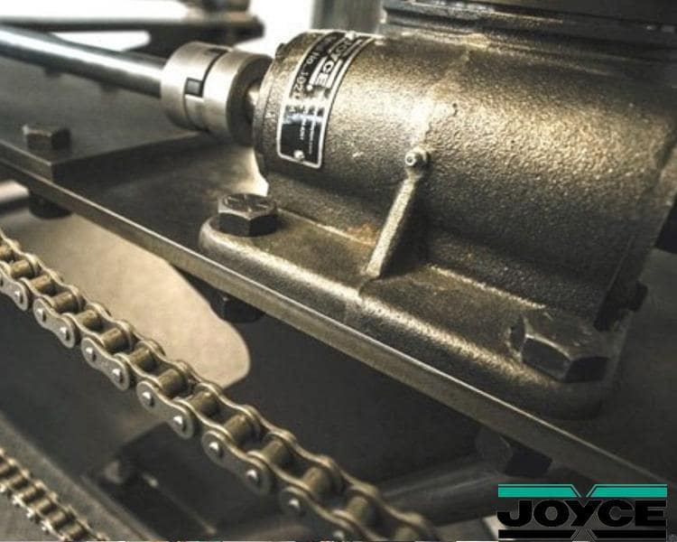 Close-up of a Joycy machine component with a chain, highlighting intricate details